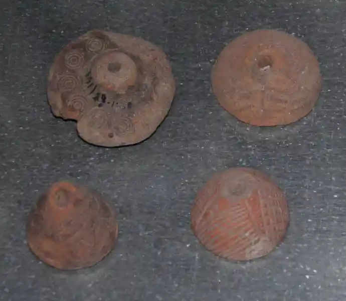 Claystone, solar cross, solar symbol on clay